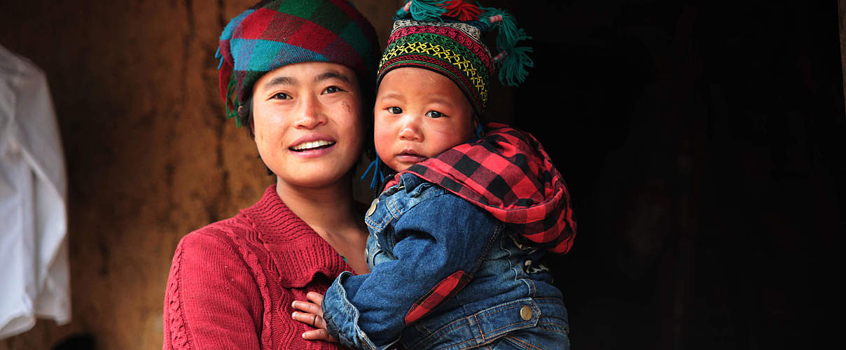 Frau mit Kind in Sechuan, China © Wang Yue